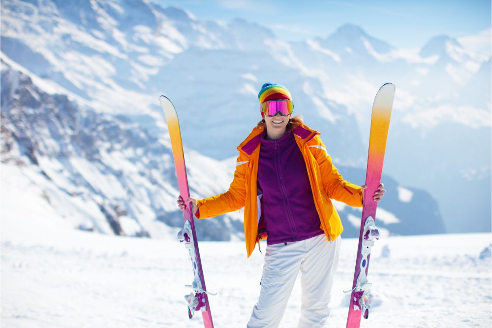 Woman in skiing clothes with  ski googles