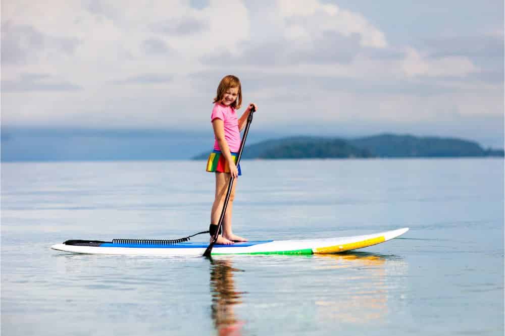 Child on stand up paddle