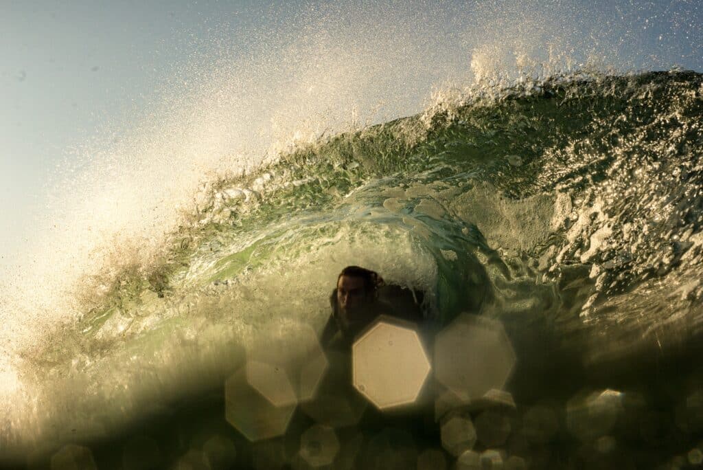 Photo by Emilio Arano showing a bodyboarder in a wave taken with a waterproof camera for an article about the best GoPro Mounts for Bodyboarding