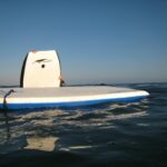 Bodyboards on the water, photo by Star5112 used in an article answering the question what makes a good bodyboard?