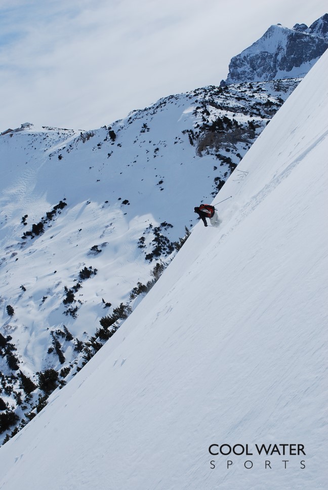 Freerider skiing a steep powder slope