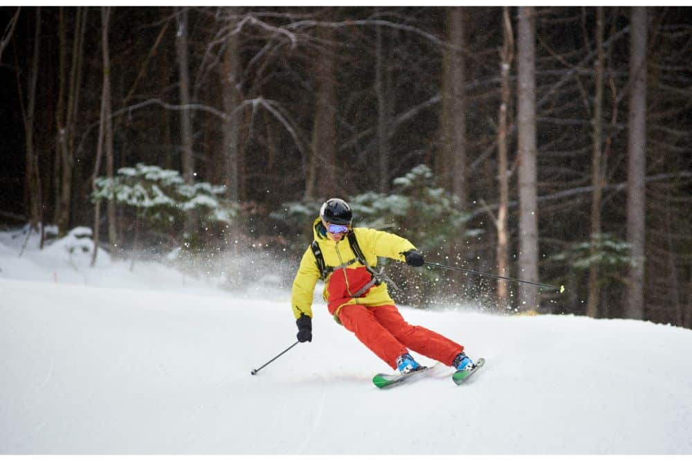 Young skier performing skiing trick