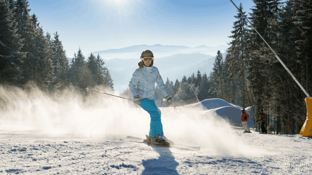 A visual representation of a woman performing a quick stop whilst skiing